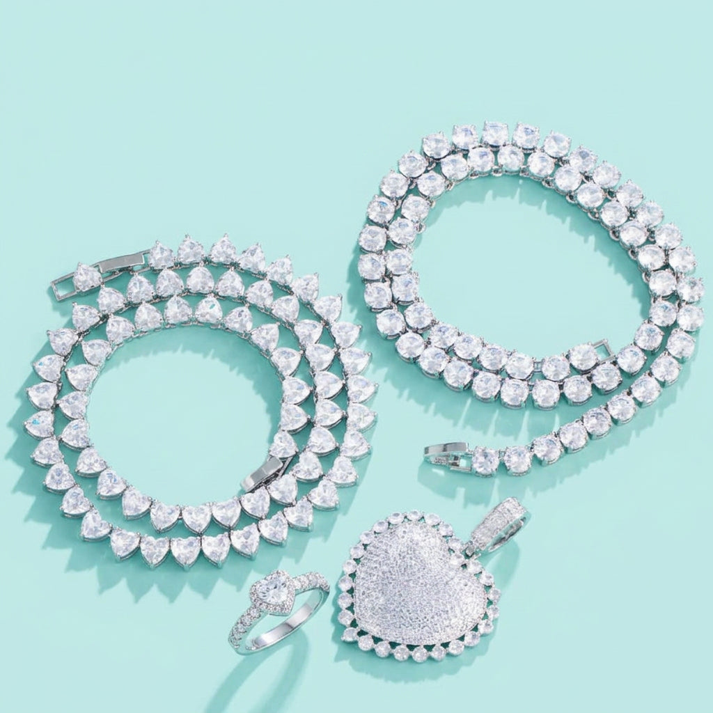 4-piece cubic zirconia heart jewelry set on aqua background
