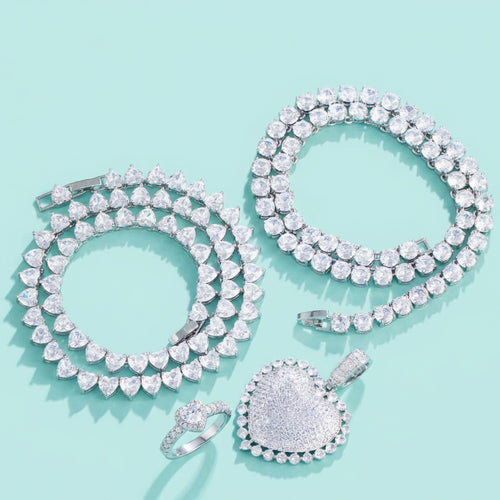 4-piece cubic zirconia heart jewelry set on aqua background
