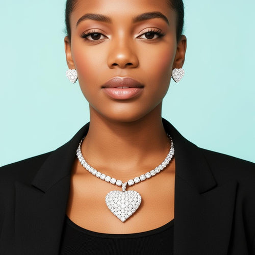 Model wearing cubic zirconia heart pendant necklace and earrings