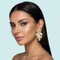 Model wearing leaf cluster sandblast gold dangle earrings