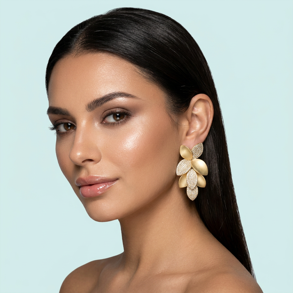 Model wearing leaf cluster sandblast gold dangle earrings