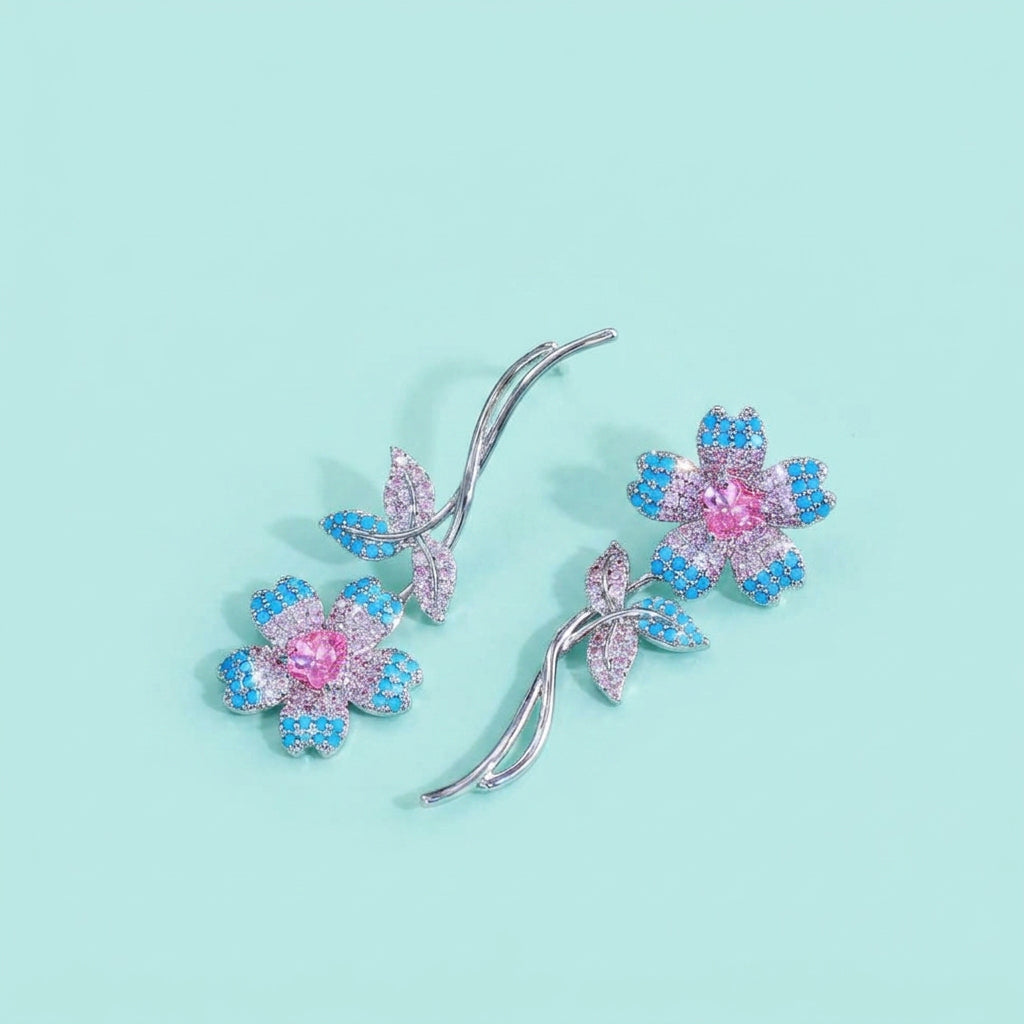 Detail of turquoise petals and pink heart CZ