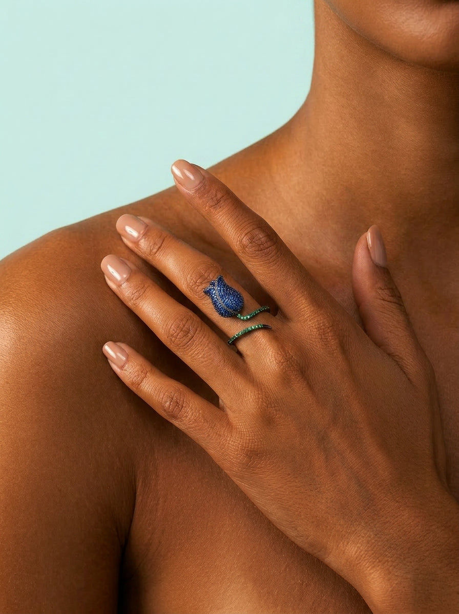 Toned model wearing royal blue rose ring