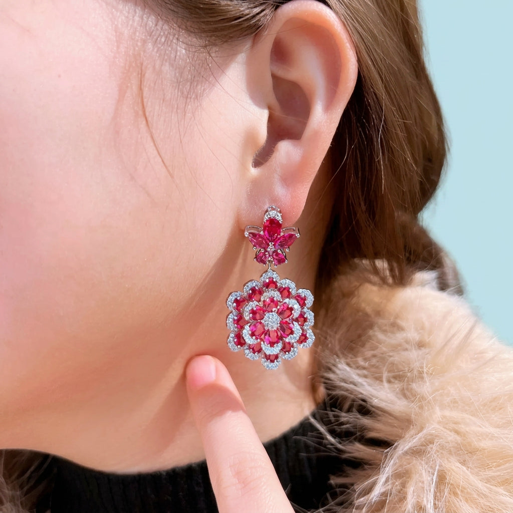 Ruby red flower CZ earrings on display