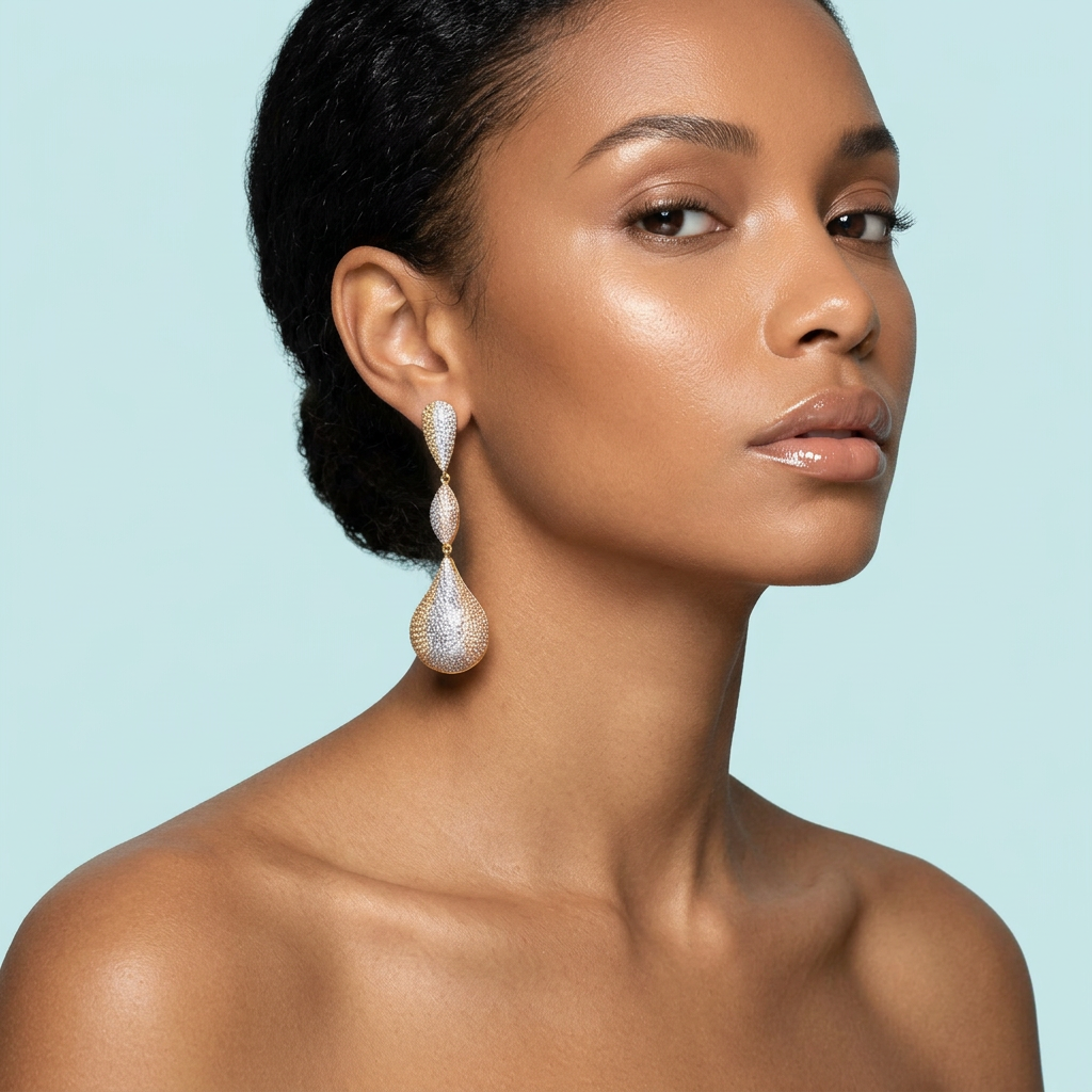 Model wearing tri-tone Dubai gold-plated long drop CZ earrings