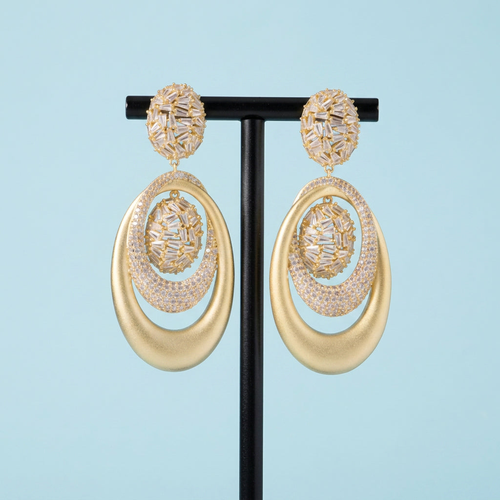 Sandblast dangle earrings on display