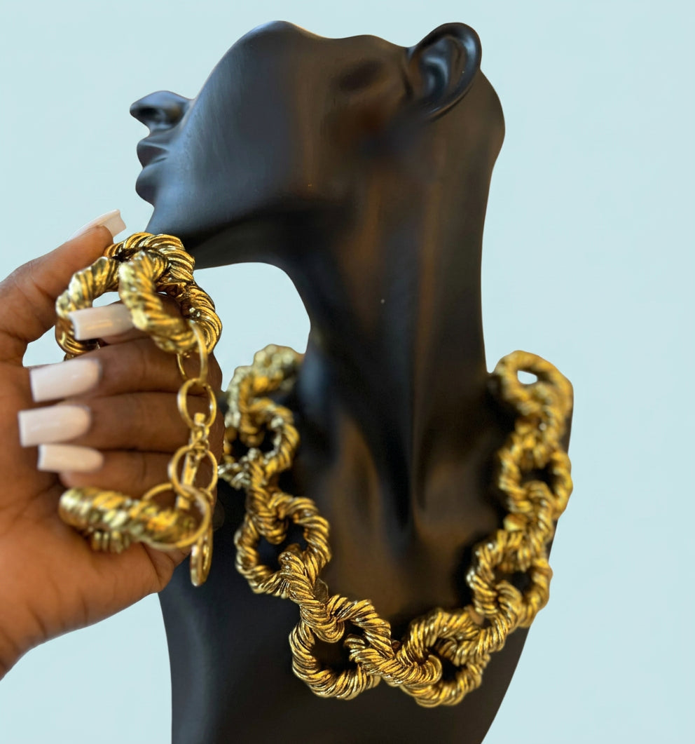 Gold twist chain necklace and bracelet set on mannequin
