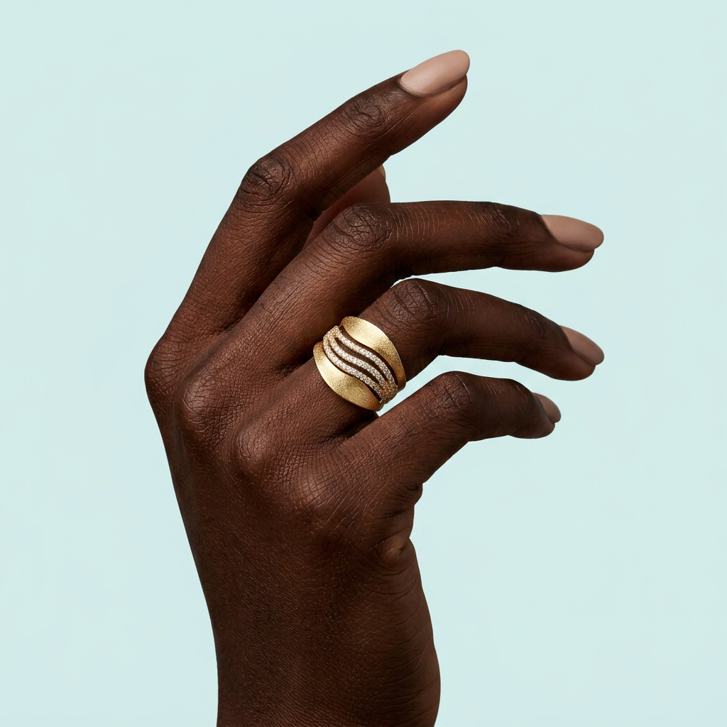 African model wearing gold cubic zirconia wave ring
